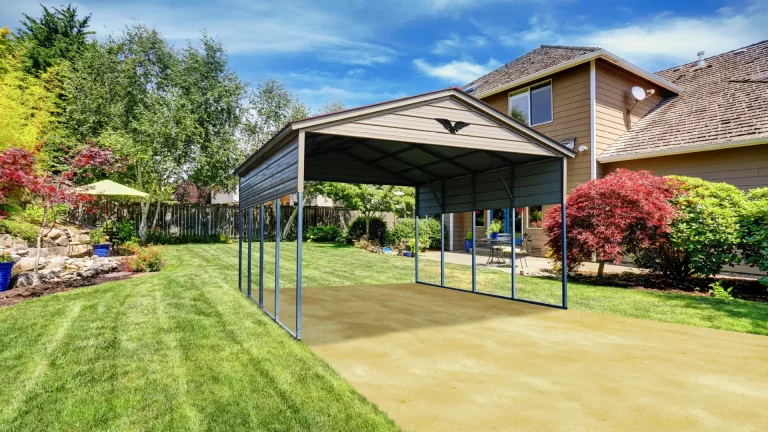 20x20x11 gable style metal carport in a landscaped yard, a durable metal carport providing covered parking and storage. Eagle Carports offers metal carports for sale to protect vehicles and equipment from the elements.